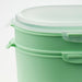 IKEA UTBJUDA stackable lunch box with ergonomic flaps and smooth plastic finish in light green.