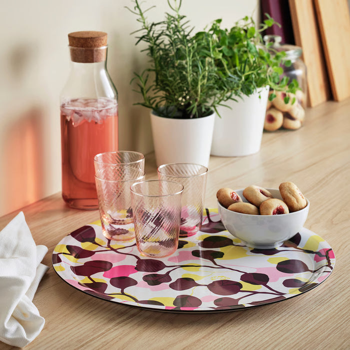  IKEA VÄDERFISK multicolour tray styled on a dining table with food and drinks