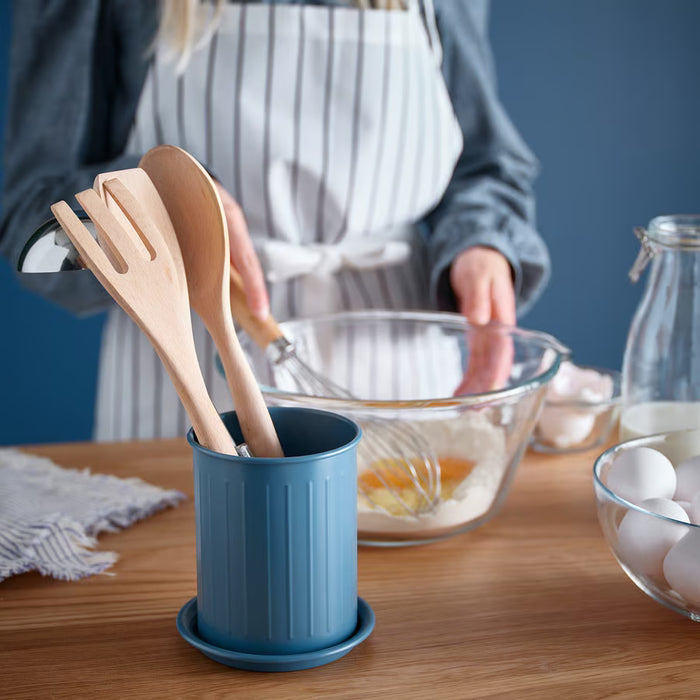: IKEA VÄLVÅRDAD cutlery stand holding wooden cooking utensils on a kitchen table while cooking