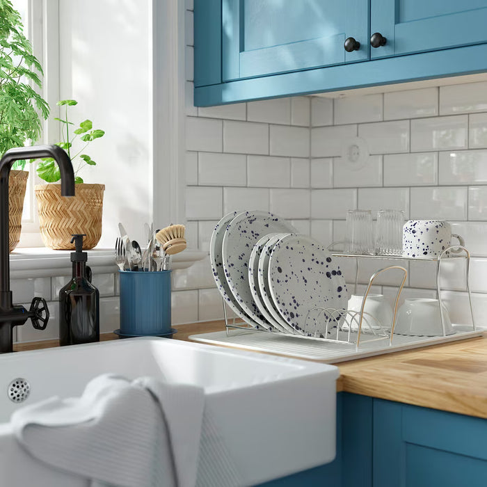 IKEA VÄLVÅRDAD cutlery stand placed on kitchen counter near window with soap dispenser and plate rack