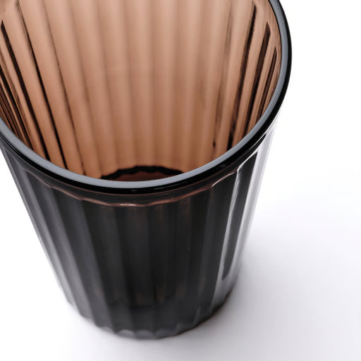 Close-up of IKEA VARDAGEN brown tumbler showing pleated fluted texture and dark tint