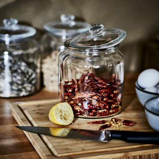 IKEA VARDAGEN glass jar with lid styled with dried chilies and lemon on wooden cutting board