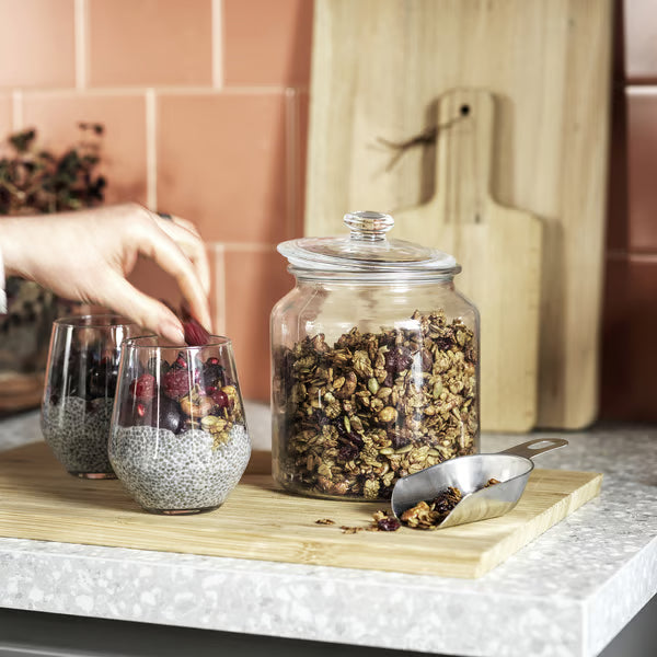 IKEA VARDAGEN glass jar with lid used to pour granola onto chia pudding bowl