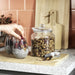 IKEA VARDAGEN glass jar with lid used to pour granola onto chia pudding bowl