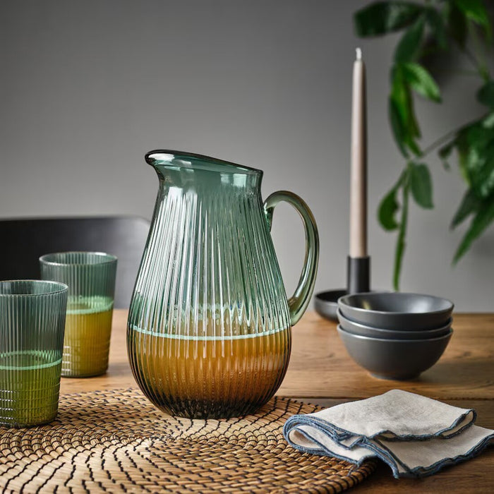 Side view of the IKEA VARDAGEN jug with a dark grey-green pattern, a wide spout, and sturdy handle.-00576653