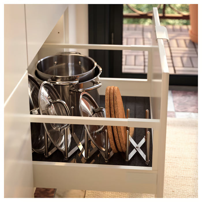 KEA VARIERA stainless steel lid organiser in use on kitchen shelf holding pot lids upright