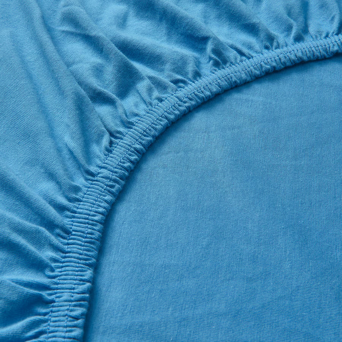 Close-up of IKEA VÅRVIAL blue cotton jersey fabric showing elastic stitching detail