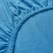 Close-up of IKEA VÅRVIAL blue cotton jersey fabric showing elastic stitching detail