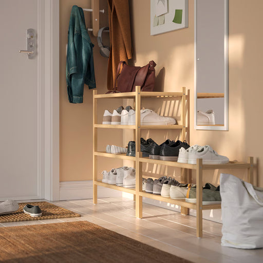  IKEA VASSKÄR bamboo shoe rack holding multiple pairs of shoes in a hallway setting