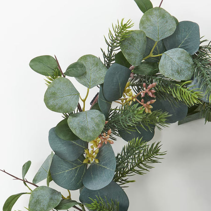 Close-up of IKEA VINTERFINT artificial eucalyptus leaves, realistic detailing