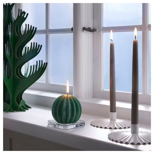 Add a touch of glamour to your home décor with this stylish tealight holder from IKEA. Its shiny metallic finish will catch the eye of any visitor 