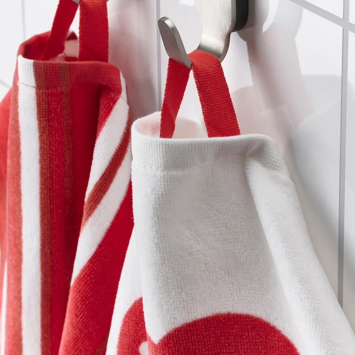 Close-up of IKEA VINTERFINT hand towel, 40x70 cm, white/red hanging on the bathroom counter as on a hook-70557745