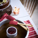 IKEA VINTERFINT red silicone spatula set of 2 close-up showing bamboo handle and flexible blade detail