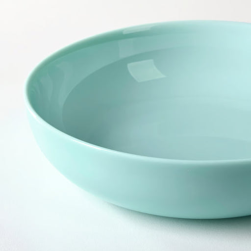 IKEA VITBLECKA turquoise plate styled with food on a minimal table arrangement