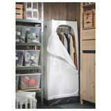 IKEA VUKU white wardrobe styled in a bedroom with clothes hanging inside compact footprint