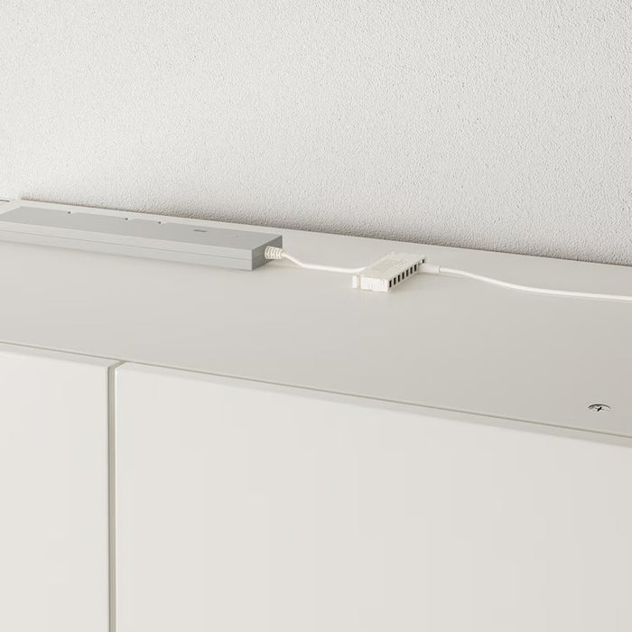 "Close-up of stylish YTBERG LED light strip under cabinet."