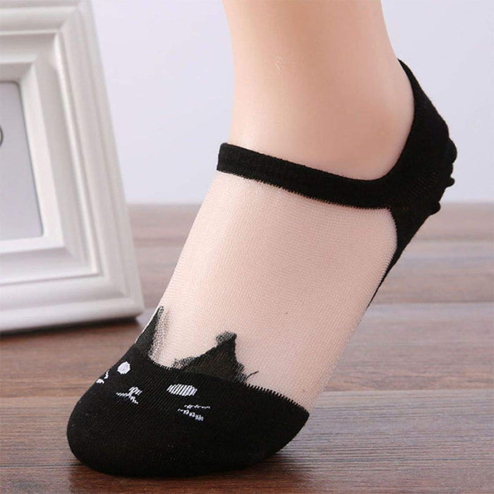 A woman wearing statement socks with a cute cat pattern made from ultra-thin transparent material.