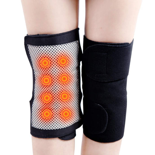 set of two knee massagers, with self-heating and magnetic properties, placed on a surface.