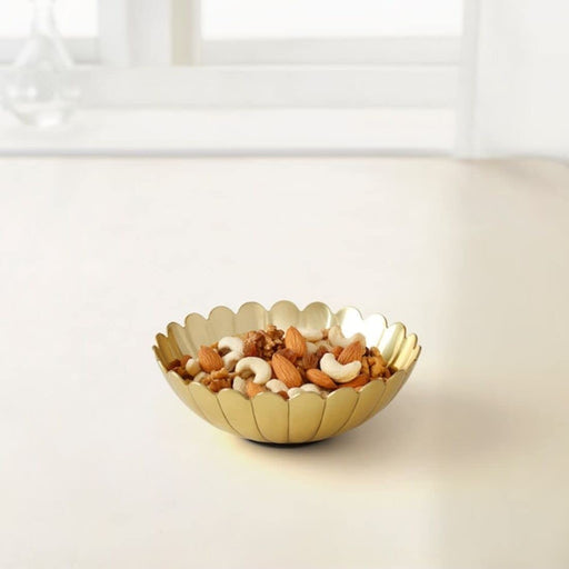 An elegant gold-colored decorative bowl from IKEA, featuring a sleek and modern design 40524662