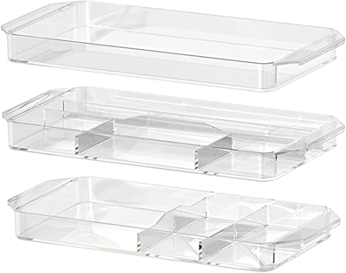 A set of three modular storage containers made from transparent acrylic