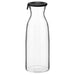 Digital Shoppy Ikea carafe with lid , An image of an IKEA carafe with a clear glass body and a lid made of cork. The carafe is filled with water and placed on a wooden table. 302.919.22