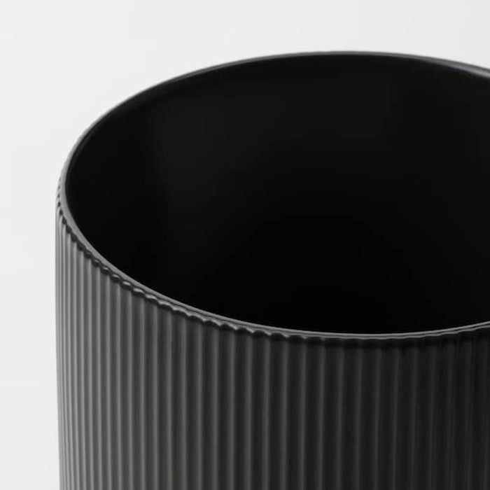 A minimalist plant pot with a matte finish and a clean, modern design. 70494791