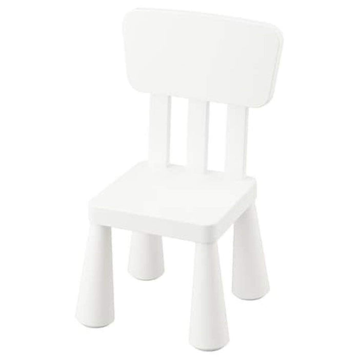 "A white IKEA children's chair with a colorful cushion in a modern living room