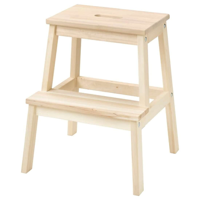 IKEA step stool with various household items on it, showcasing its practical use in home organization.