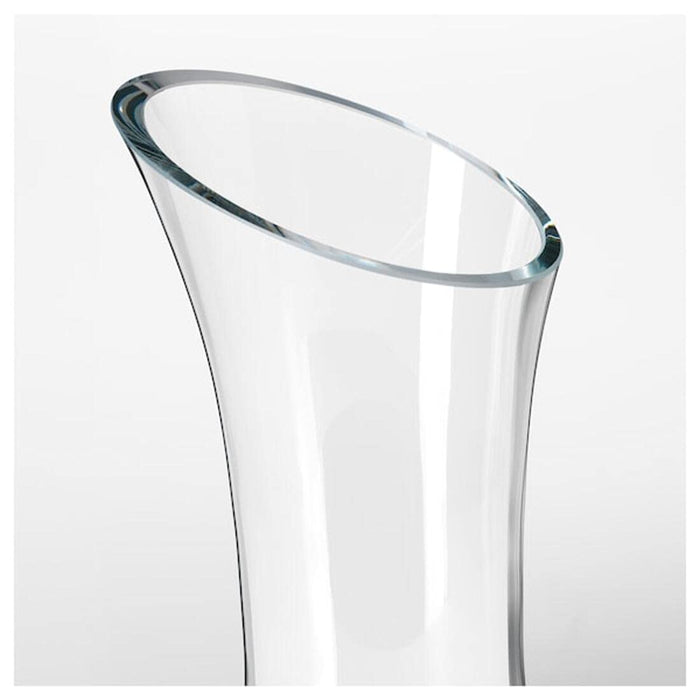 The clear glass carafe with a simple yet stylish design, suitable for any occasion.