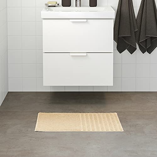 IKEA bath mat placed on a bathroom floor, featuring a soft and absorbent texture and a non-slip bottom for secure footing  00488147