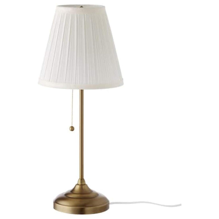 Industrial-style IKEA table lamp with a metal shade and base, adding a touch of edgy and modern flair to a workspace,40321377