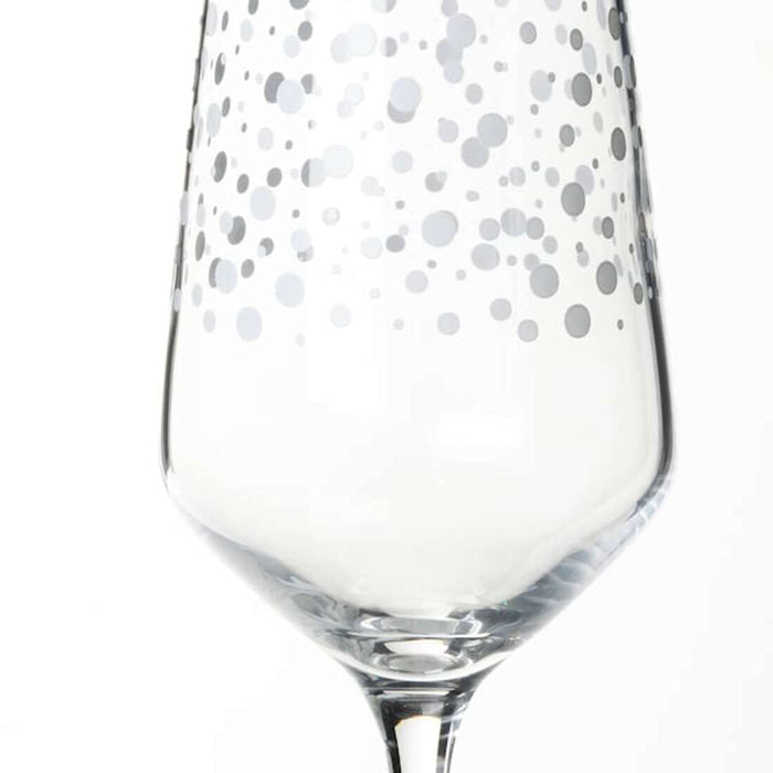  IKEA champagne glass with a clear glass stem and a rounded bowl that is slightly wider at the top.