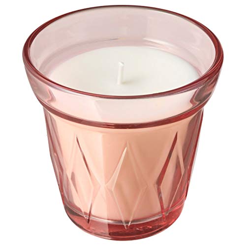 IKEA scented candle in a glass jar with natural elements, perfect for creating a cozy and inviting ambiance in any room.