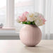 A decorative round vase from Ikea, filled with artificial flowers and perfect for low-maintenance home decor 10516404