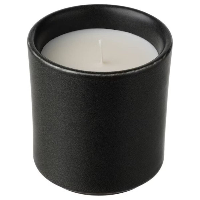 A decorative and stylish candle in pot from IKEA, perfect for adding a touch of elegance and sophistication to your home decor.