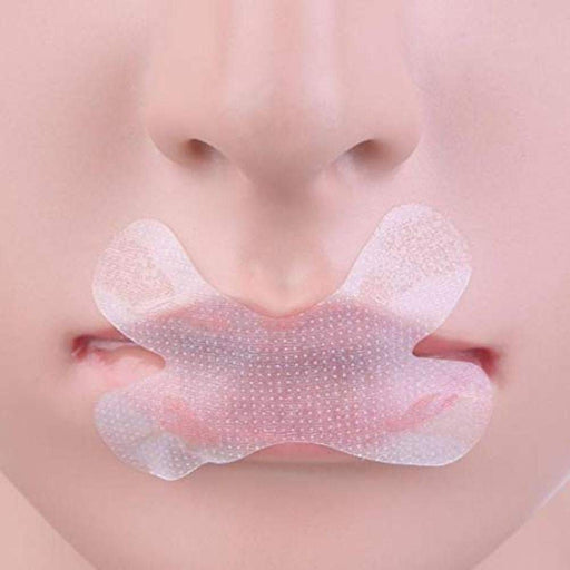 A person sleeping peacefully with a snore stopper nasal lip sticker applied to their mouth.