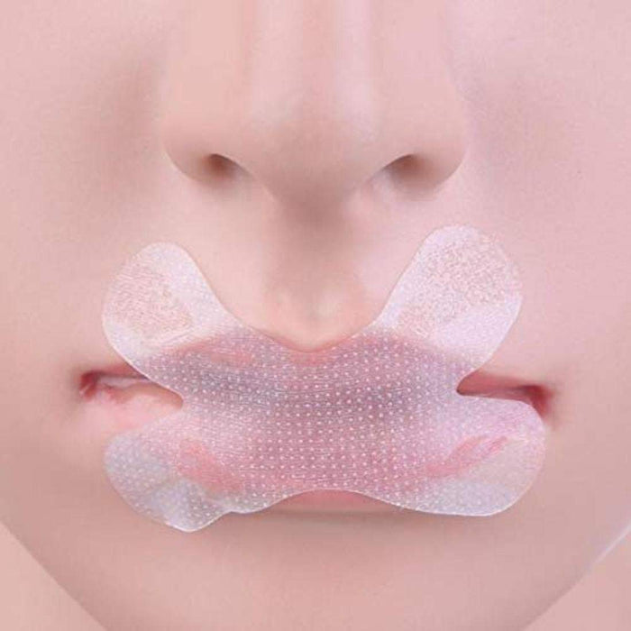 A person sleeping peacefully with a snore stopper nasal lip sticker applied to their mouth.
