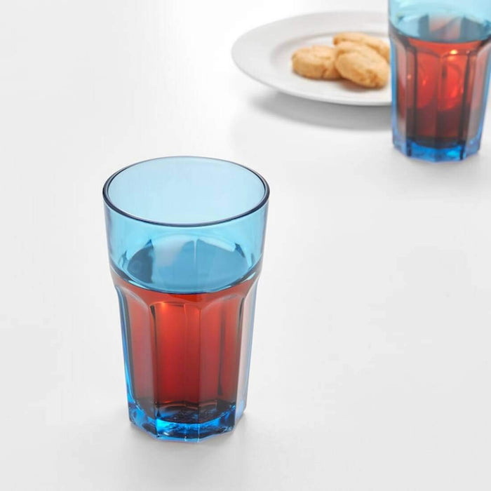 An IKEA blue glass, 35 cl, filled with ice and a cold beverage 00461020