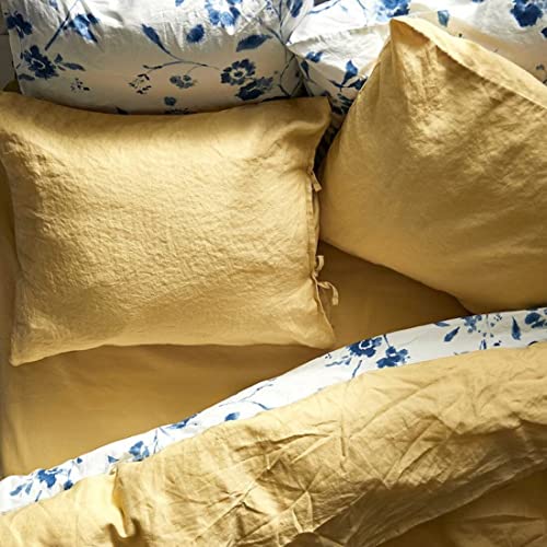 A close-up shot of IKEA's duvet cover in a soft Light Yellow  color with matching pillowcases.  80431581