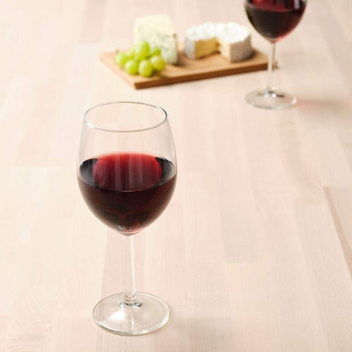 IKEA wine glass, made from clear glass and featuring a long stem and a rounded, slightly tapered bowl that is perfect for holding red  wine