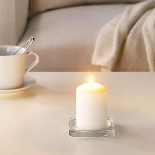 A set of blue unscented block candles from IKEA, bringing a calming and peaceful ambiance to a room.