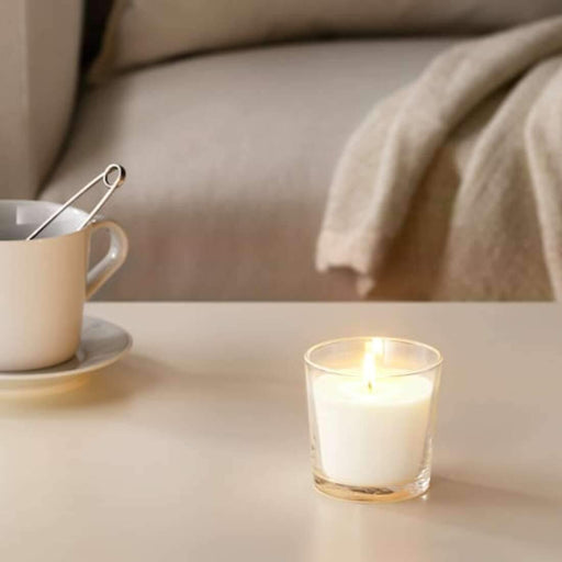 A soy wax candle with a natural scent, in a chic and stylish glass jar from IKEA.