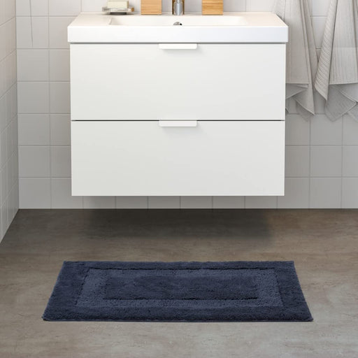  IKEA bath mat placed on a bathroom floor, featuring a soft and absorbent texture and a non-slip bottom for secure footing 50500137