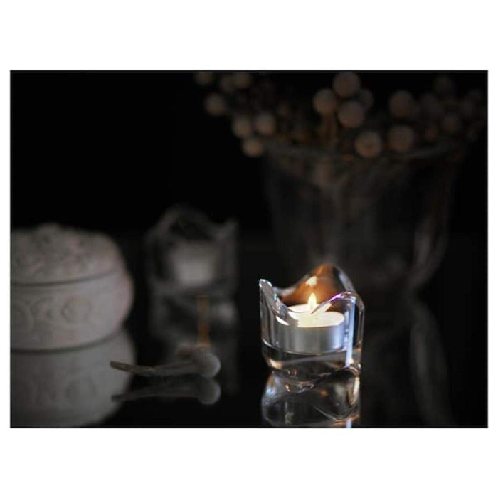 An unscented candle in a clear glass jar, perfect for enhancing the ambiance and tranquility of any space.