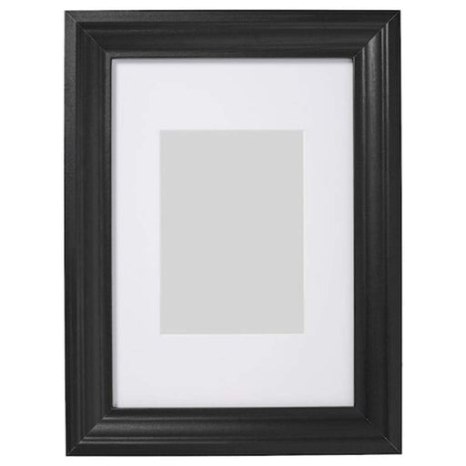 A sleek photo frame with a white mat, perfect for displaying your favorite memories  60427622