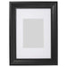 A sleek photo frame with a white mat, perfect for displaying your favorite memories  60427622