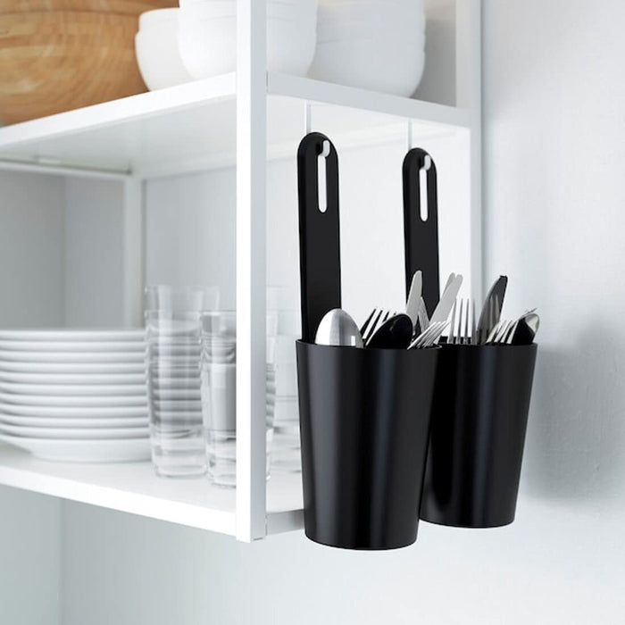IKEA black container with lid, 12x34 cm size, being used to organize spices in a kitchen cupboard v-10481777