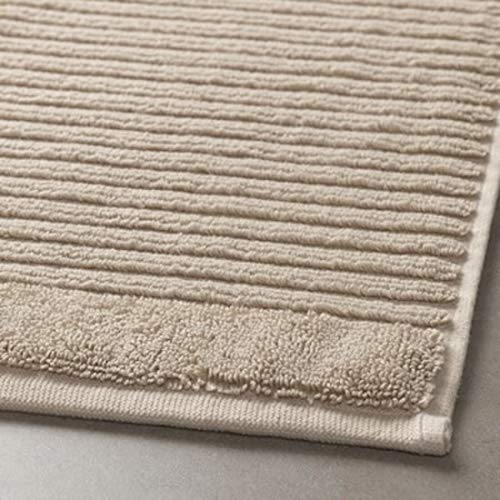 Thick and luxurious beige bath mat from IKEA, with a plush texture that provides comfort and warmth to your feet after a shower or bath 30449244