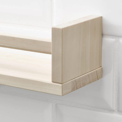 Close-up of IKEA BEKVÄM aspen spice rack showing smooth natural wood grain finish and side supports