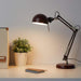 A dark red IKEA work lamp with a sleek and modern design, featuring an adjustable arm and a cone-shaped shade40457295